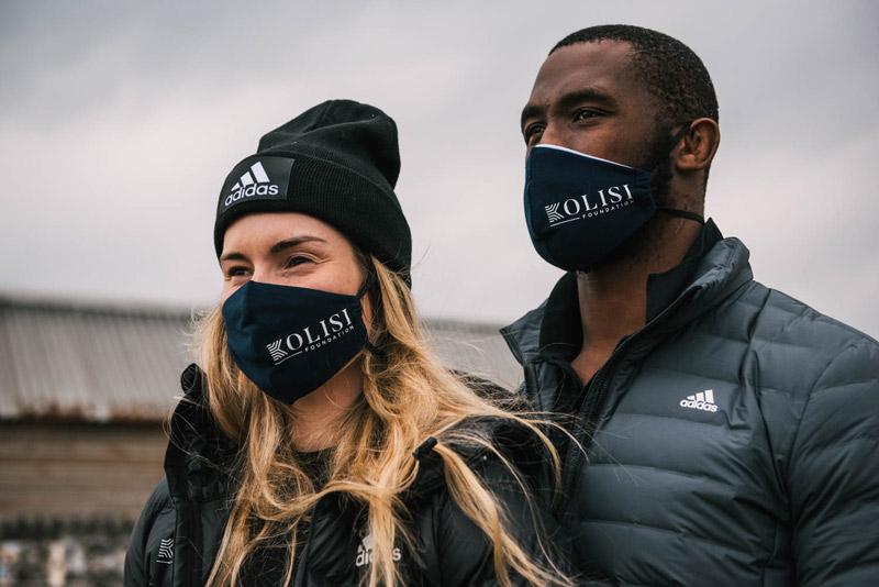 Rachel and her husband, South African rugby captain, Siya Kolisi wearing Kolisi Foundation masks.
